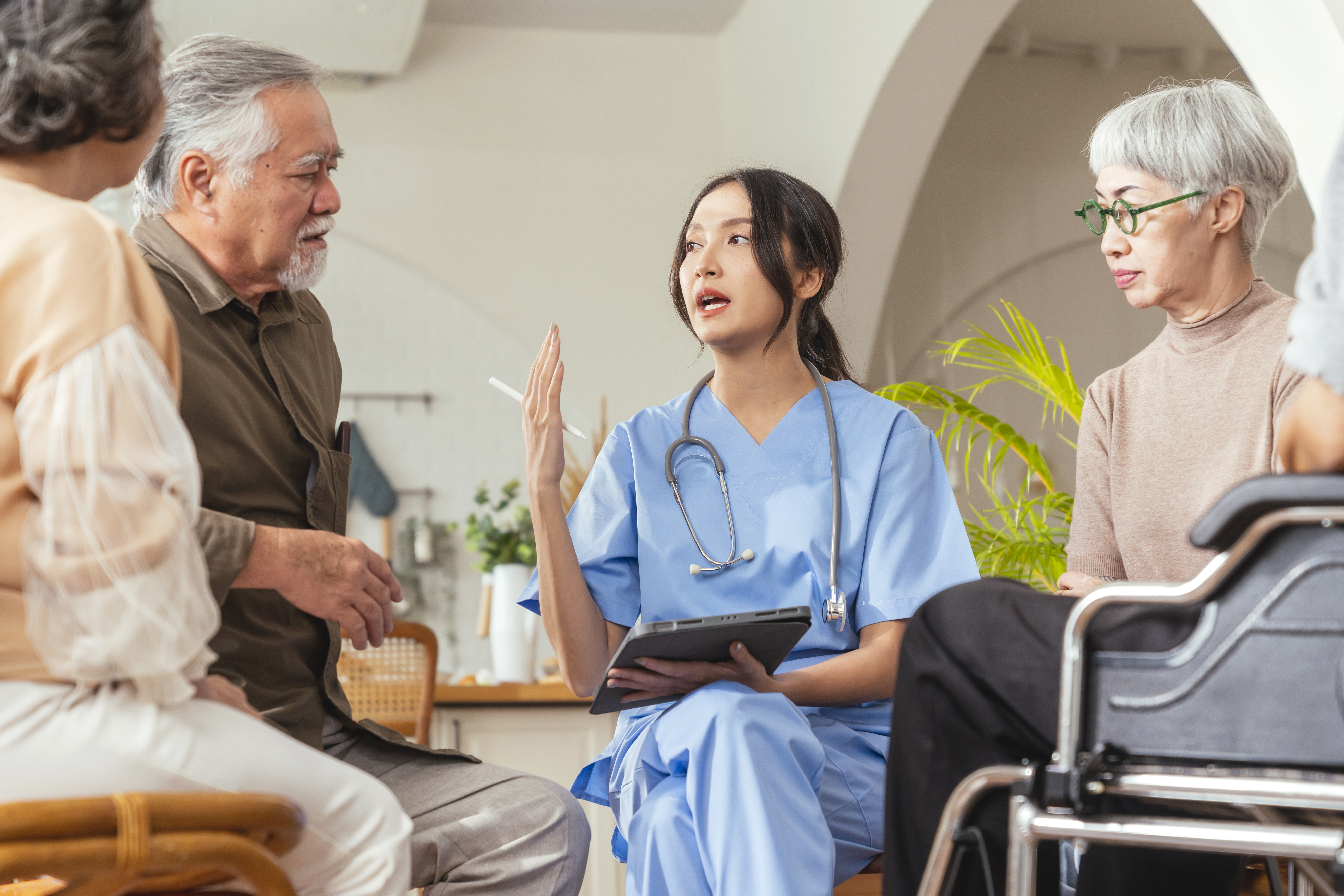family speaking with a healthcare worker at a clinic